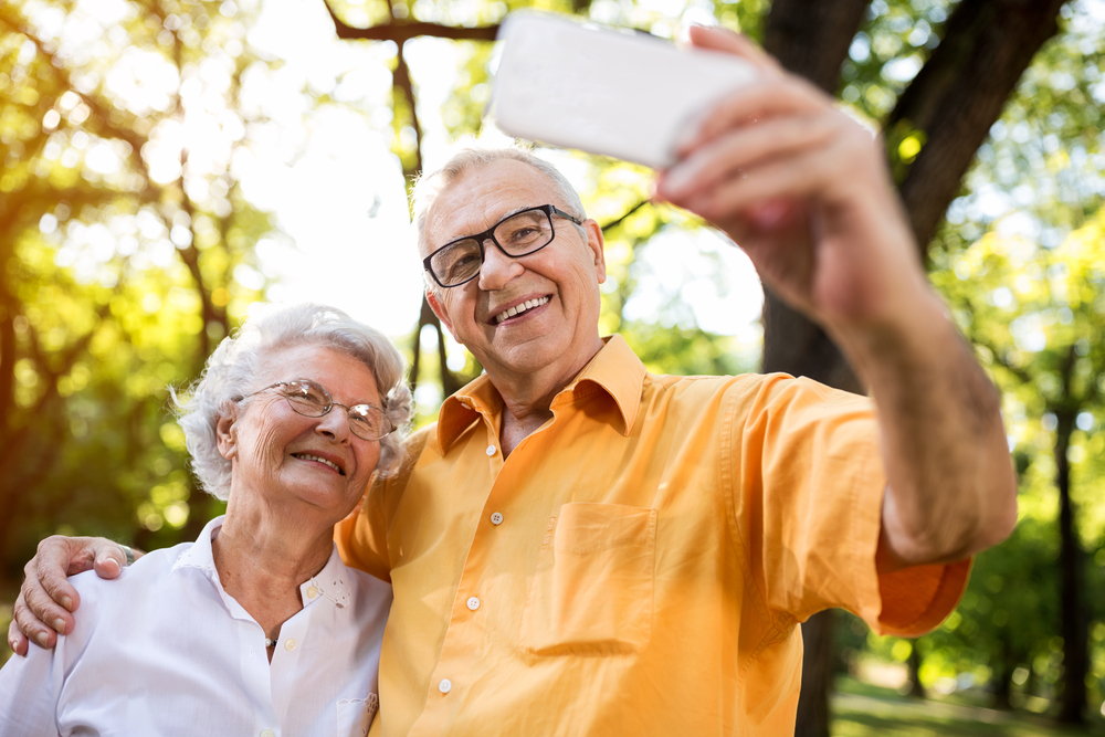 Older man and women taking selfie